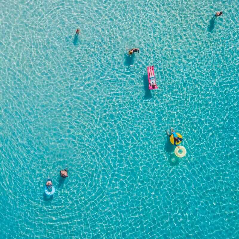 One way of overcoming your fear of swimming is to Wear a life jacket or floatation device